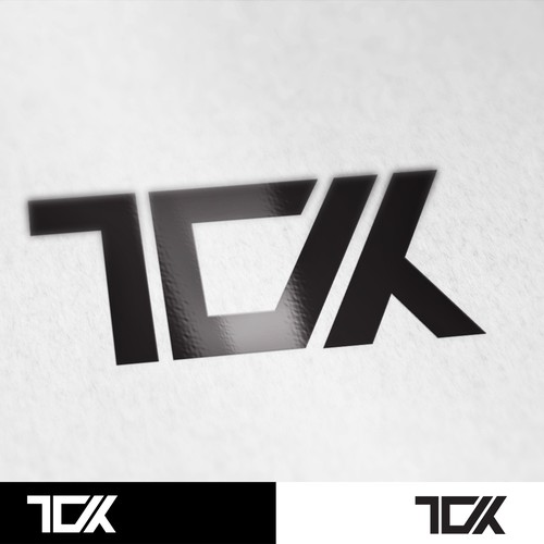 Bold TCK monogram.