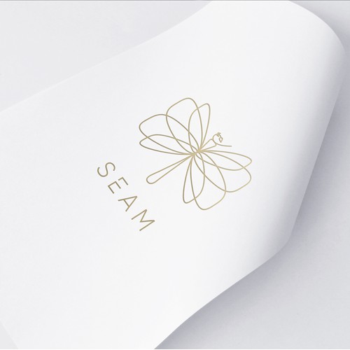 Unique Seam logo design depicting dragonfly made out of needle and thread.