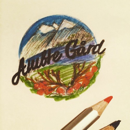 Create a logo for an organic tourist farm in Fjord-Norway