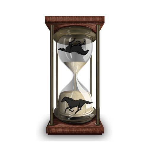 Black horse running, reflected in an hourglass