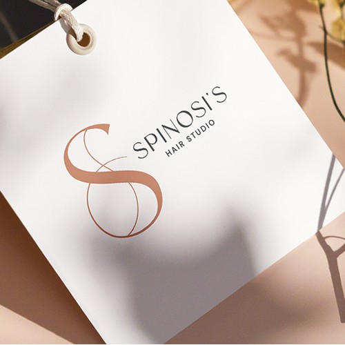 An elegant monogram design for a hair studio 